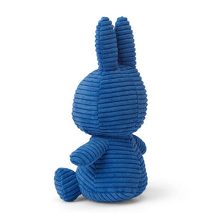 From behind sitting Miffy Bunny Rabbit children’s plush soft toy covered in cobalt blue corduroy fabric. 